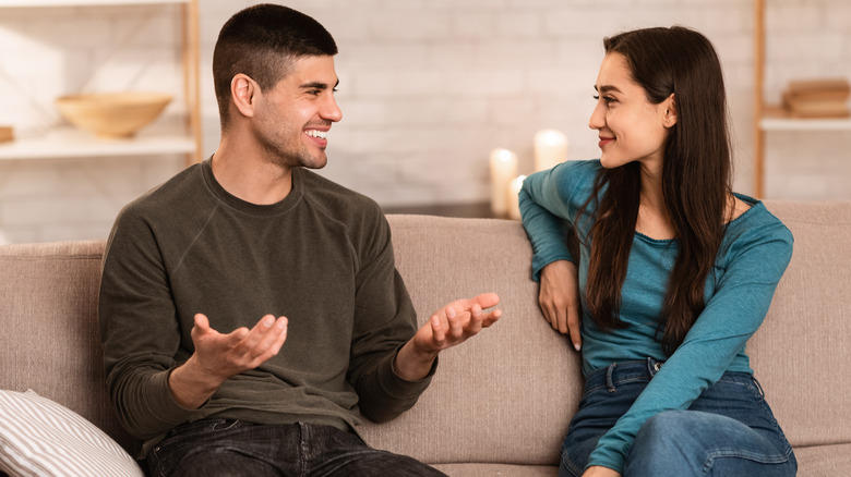 Couple having a talk on the couch