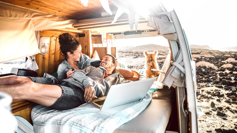 Couple camping together in a van 