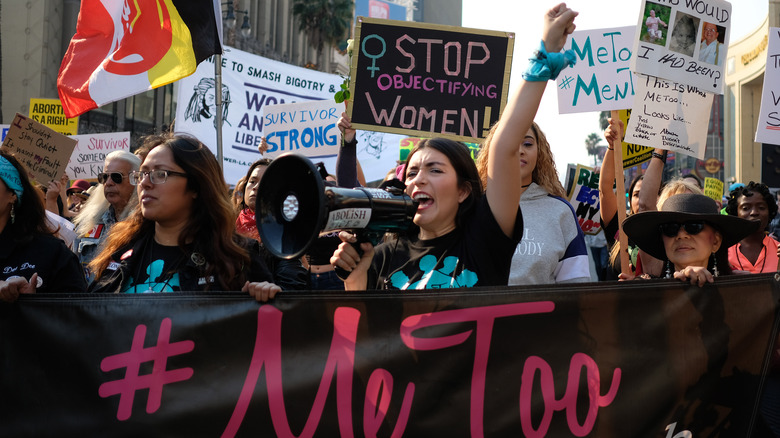 Protestors holding signs 