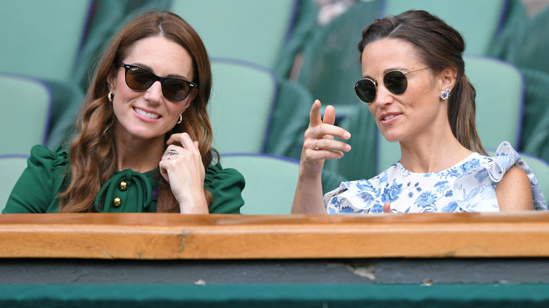 Kate Middleton with Pippa Middleton watch an event