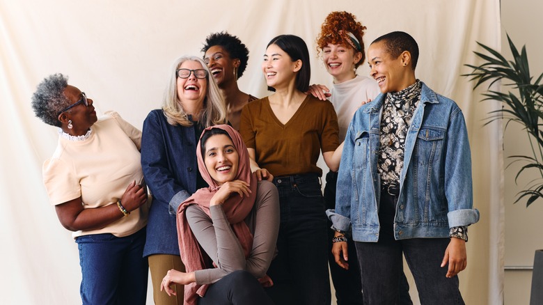 A group of women smile for a photo. 