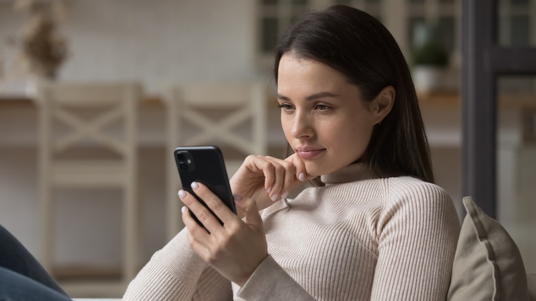 A woman looking at her phone. 