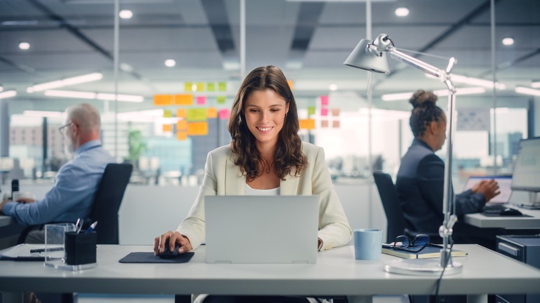 Woman smiling while working at a desk