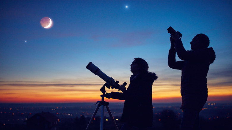 People watching a lunar eclipse 