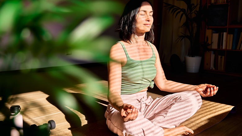 Woman meditating and practicing yoga