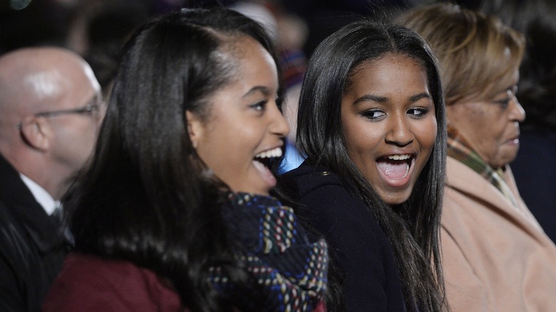 Malia and Sasha Obama laughing