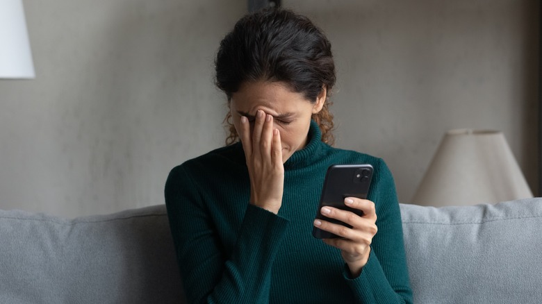 A woman holding her cell phone. 