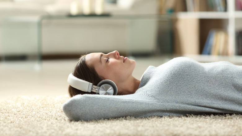 Woman meditating with headphones 