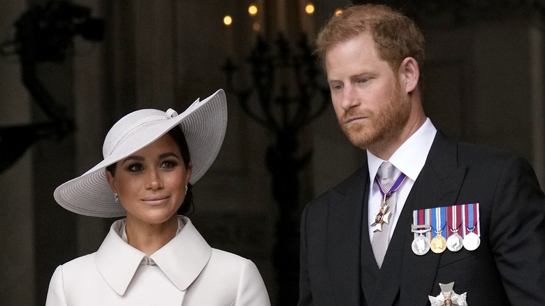 Meghan Markle and Prince Harry look perturbed at the Platinum Jubilee