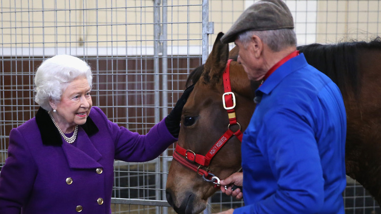 Queen Elizabeth and Monty Roberts at a horse training