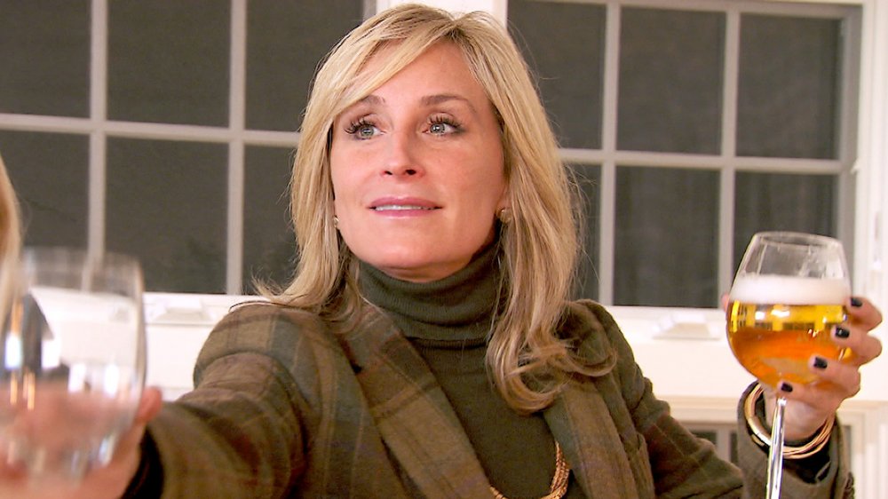 Sonja Morgan from the Real Housewives franchise with a glass of wine