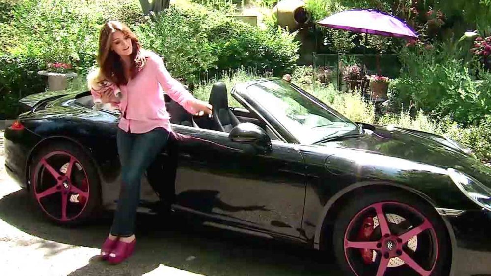 Lisa Vanderpump from Real Housewives leaning on her car