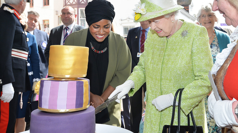 Queen Elizabeth II cutting her birthday cake