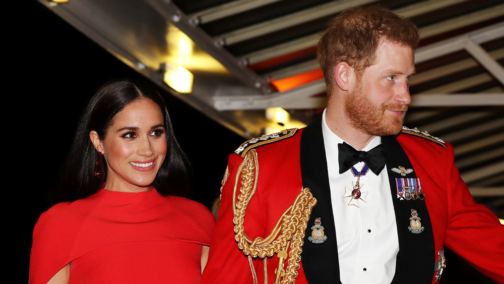 Meghan Markle and Prince Harry wearing red