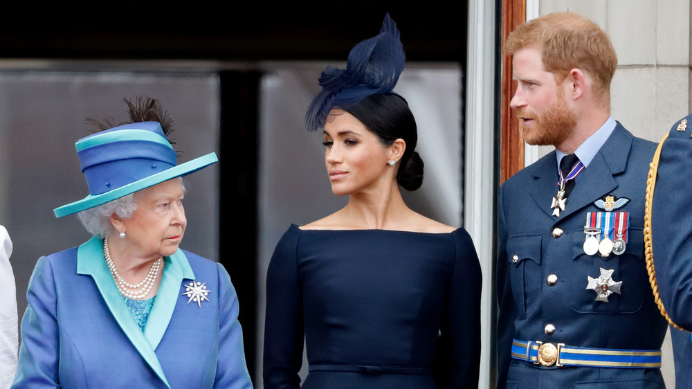 Queen Elizabeth, Meghan Markle, and Prince Harry