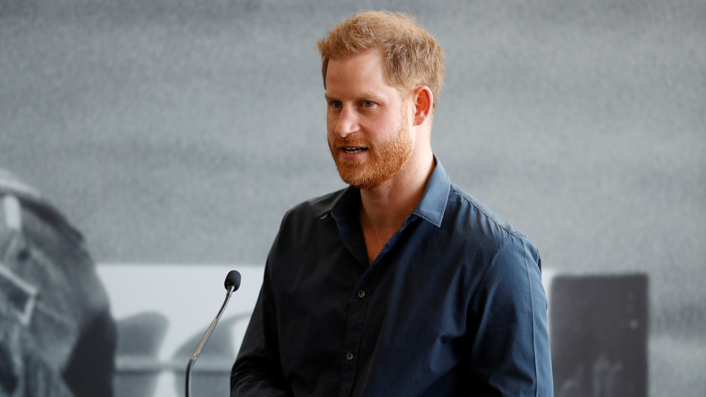 Prince Harry speaking into a mic