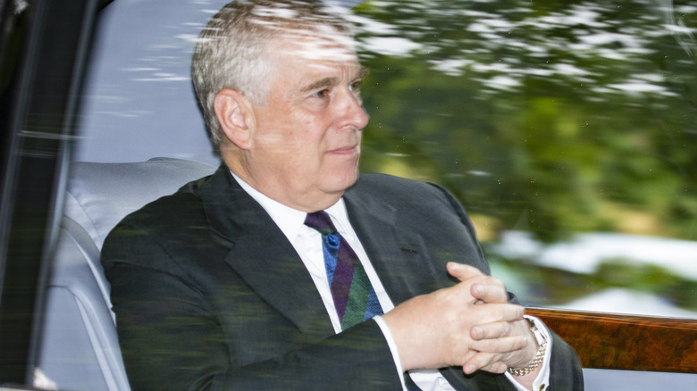 Prince Andrew riding in a car