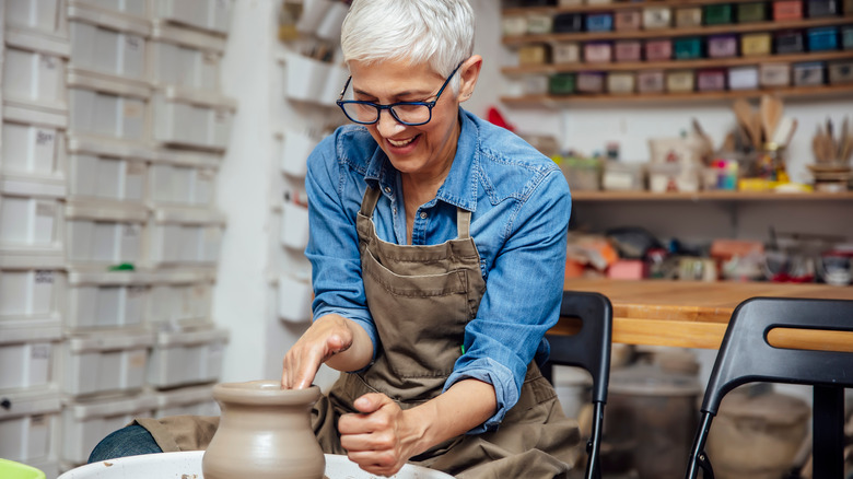 A woman working on a clay project. 