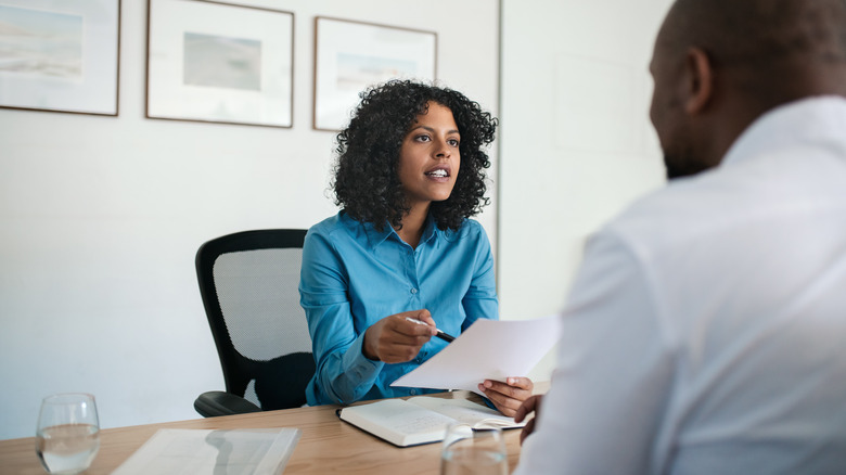 Woman speaking to employer