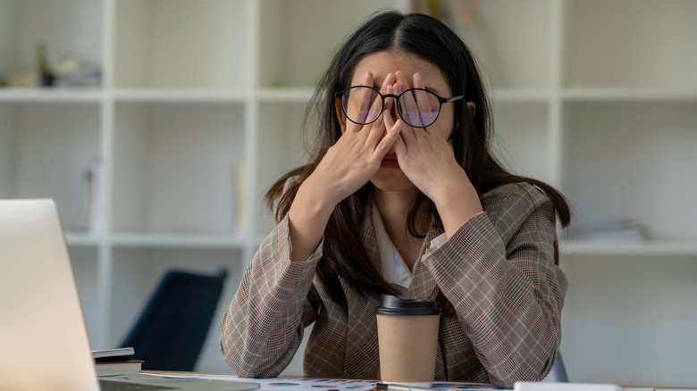 A woman feeling stressed. 