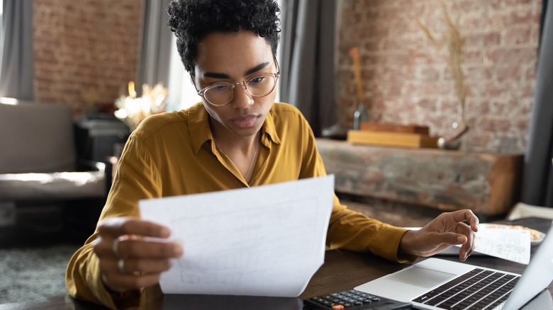 Serious woman looking at a document