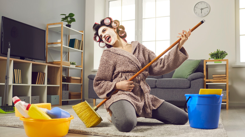 A woman cleaning her home 