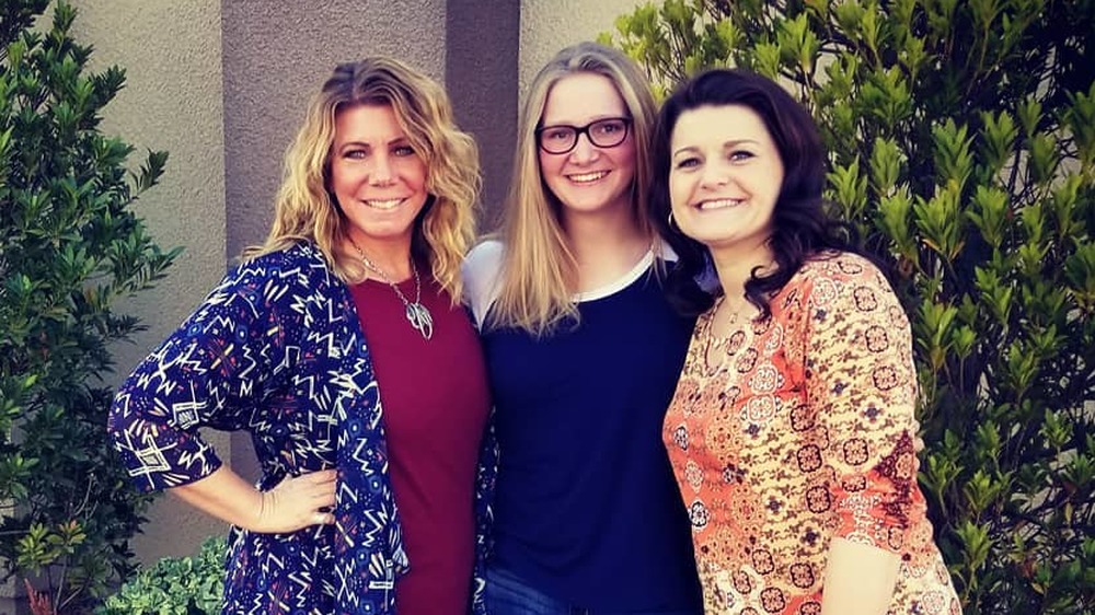 Meri Brown and Robyn Brown with one of their daughters on Sister Wives