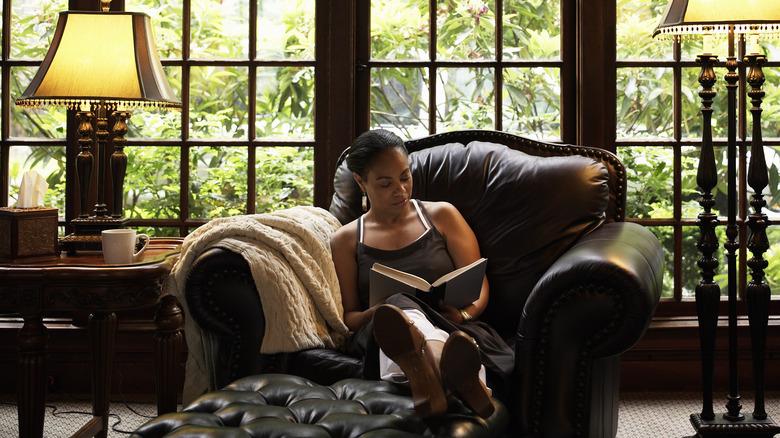 Woman reading in cozy chair