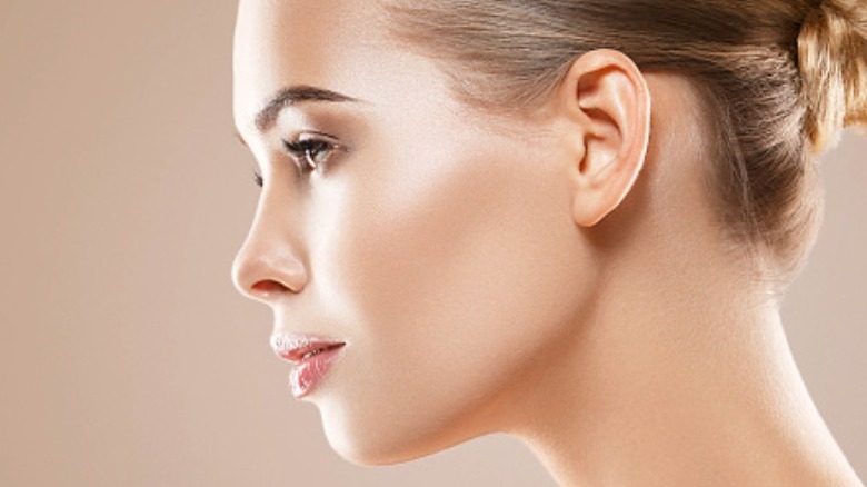 Side profile of a woman with flawless foundation