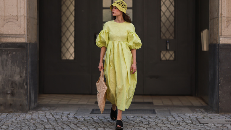 Woman in green dress posing