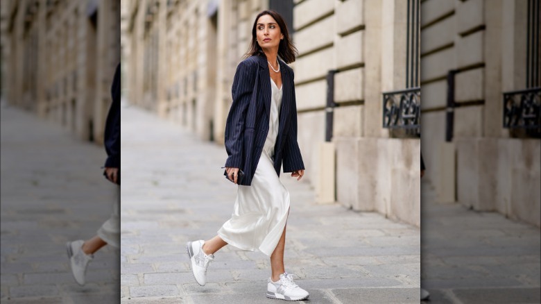 Woman wearing white sneakers