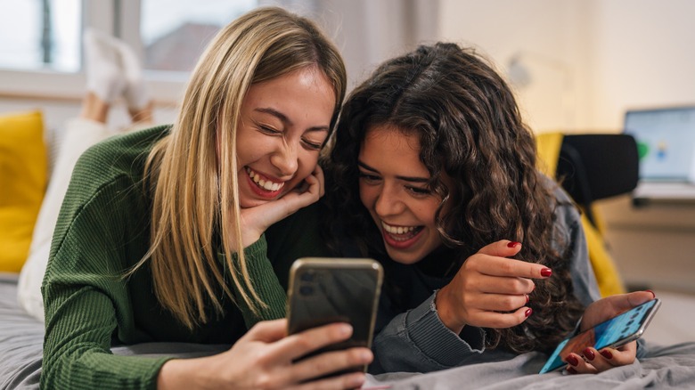 Two women laughing together