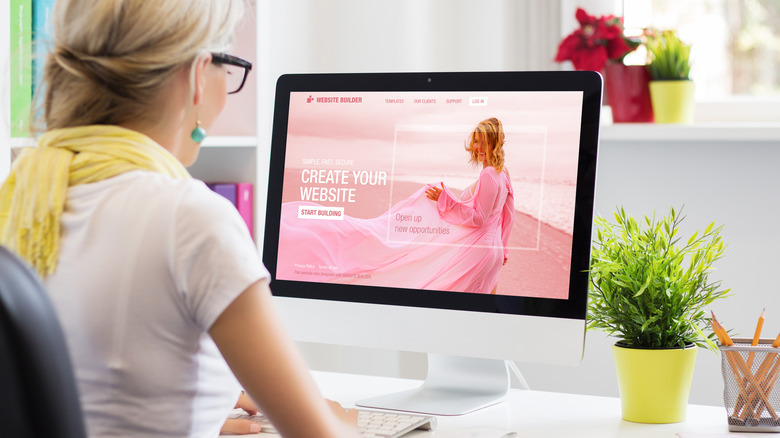 Woman using a website builder