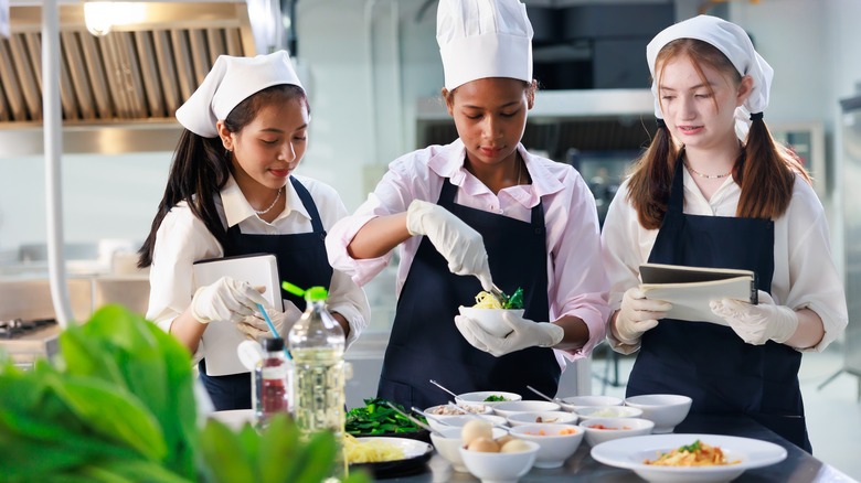 Culinary school students learning to cook