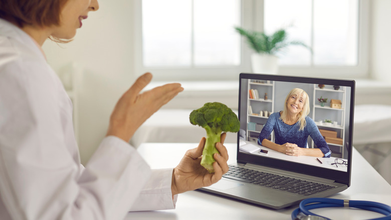 Female nutritionist counseling a client online