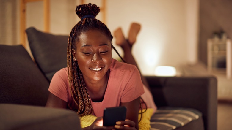 woman texting at home