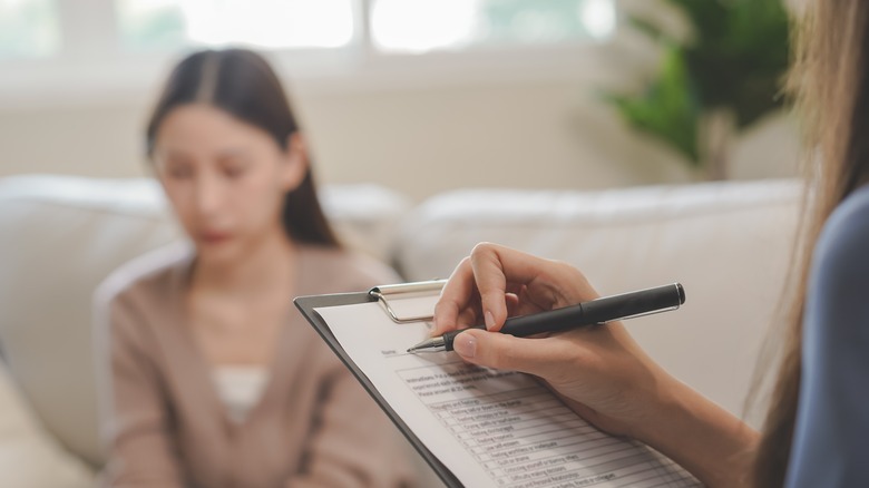 Woman writing on a form