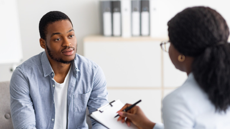 Man talking to therapist