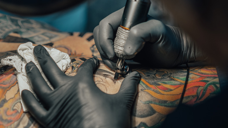 person getting tattooed