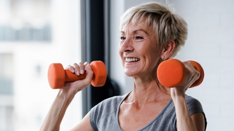 Older woman with weights