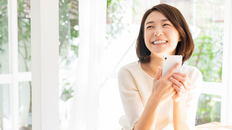 woman smiling in sunshine 