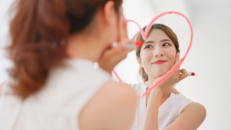 woman gazing into mirror 