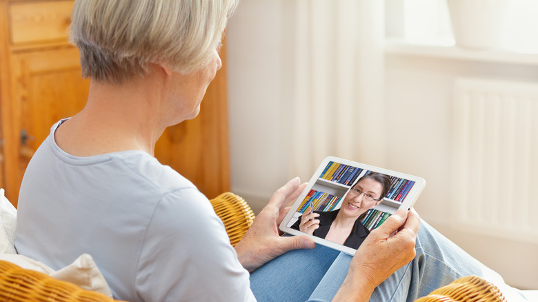 Woman having teletherapy session