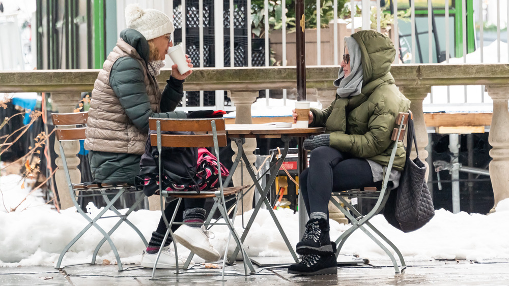 Two people dining outdoors