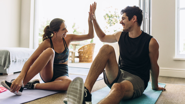 Two people exercising together. 