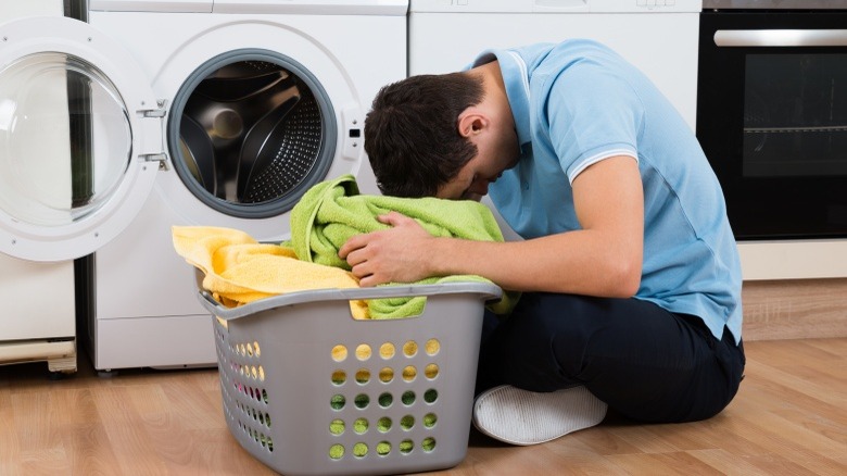 Man folding laundry