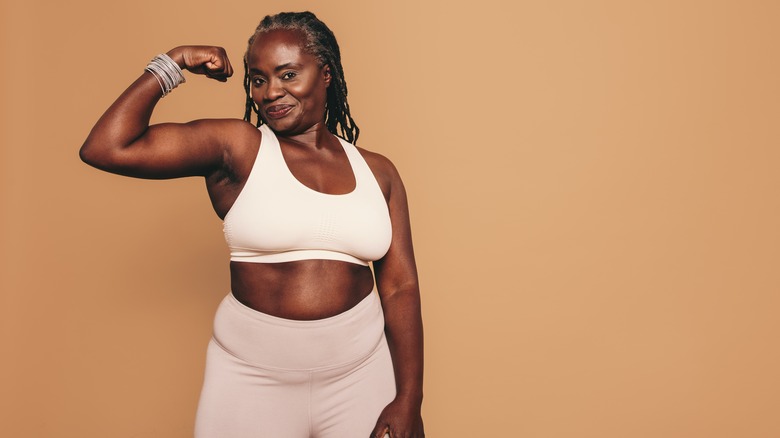 Woman in off white sports bra and leggings