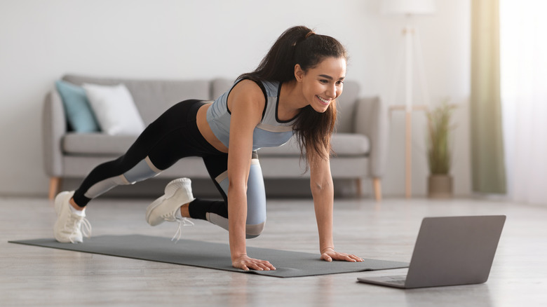 Woman working out in living room