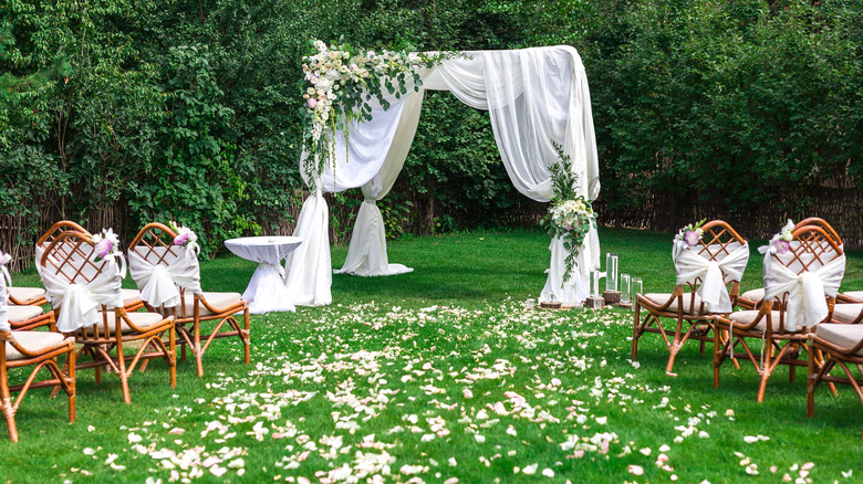 Outdoor wedding aisle, chairs, and alter 