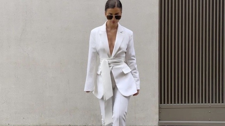 woman in a white suit